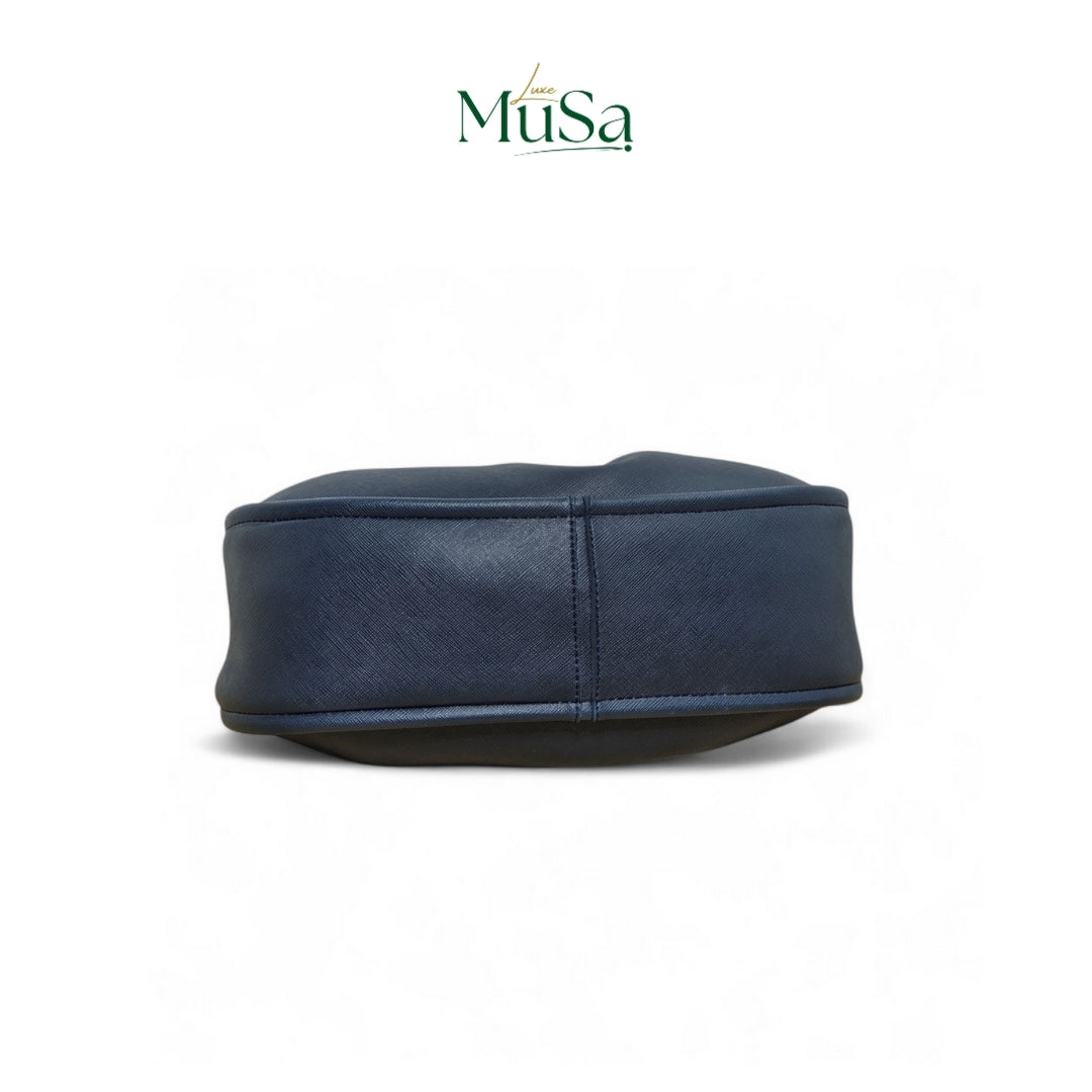 Blue leather HANDBAG on a white background with 'MuSa' branding.